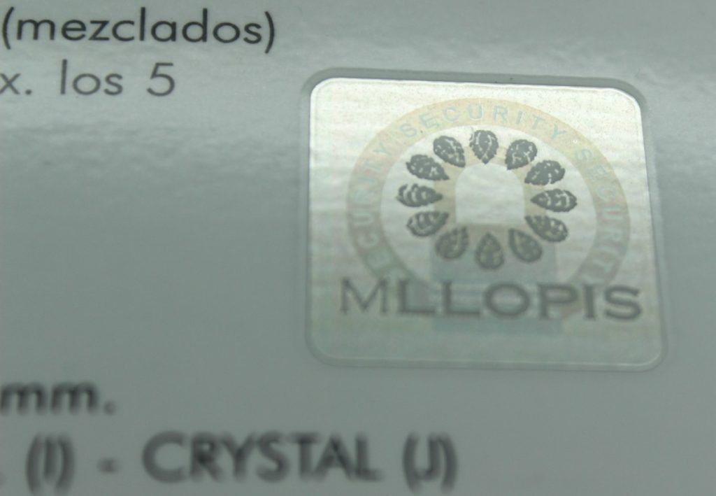 Sello holográfico del Laboratorio Gemológico MLLOPIS